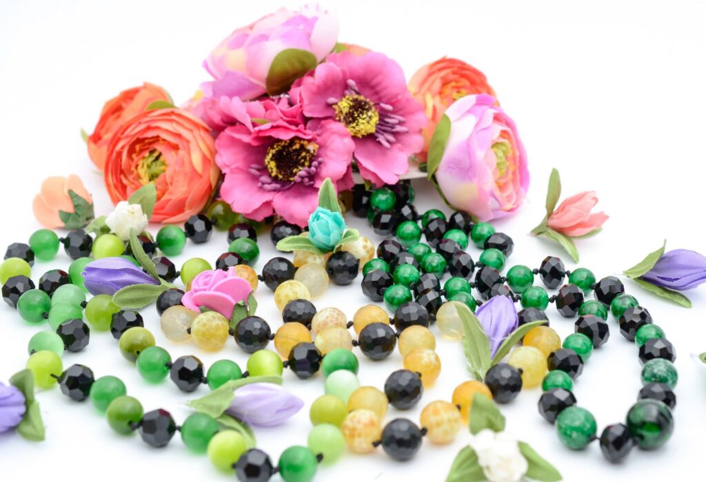 beads and flowers on white